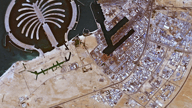 A before and after photo from space showing flooding around Jebel Ali, Dubai on April 17. European Space Agency / Getty Images