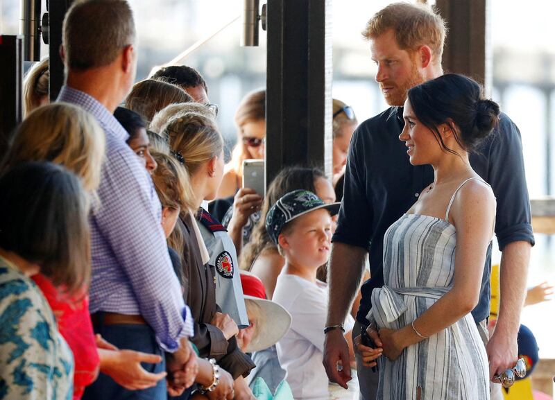 Britain's Prince Harry and Meghan, Duchess of Sussex, greet members of the public in Kingfisher Bay on Fraser Island in Queensland, Australia. Reuters