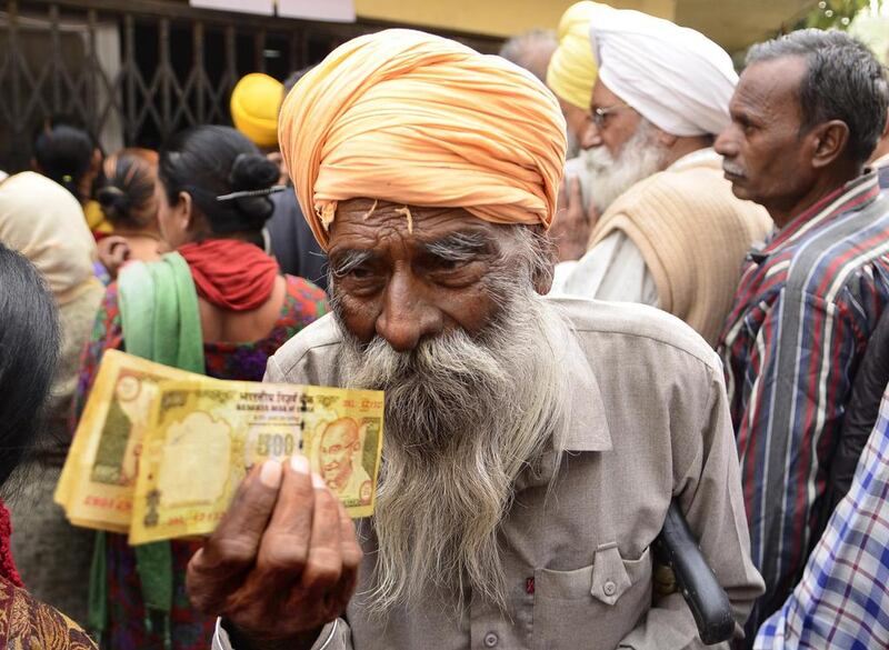 Jaswant Singh, 84, a retired policeman, was one of thousands of senior citizens desperate to exchange 500 and 1,000 rupee notes before they become worthless. Getty Images.