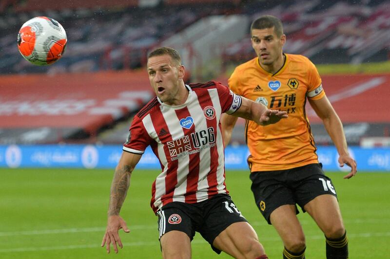 Sheffield United's Billy Sharp, left, vies with Wolverhampton Wanderers' Conor Coady. AFP