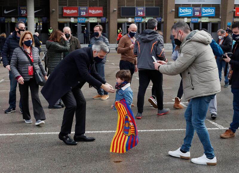 Candidate Victor Font poses with a young supporter outside the stadium. Reuters