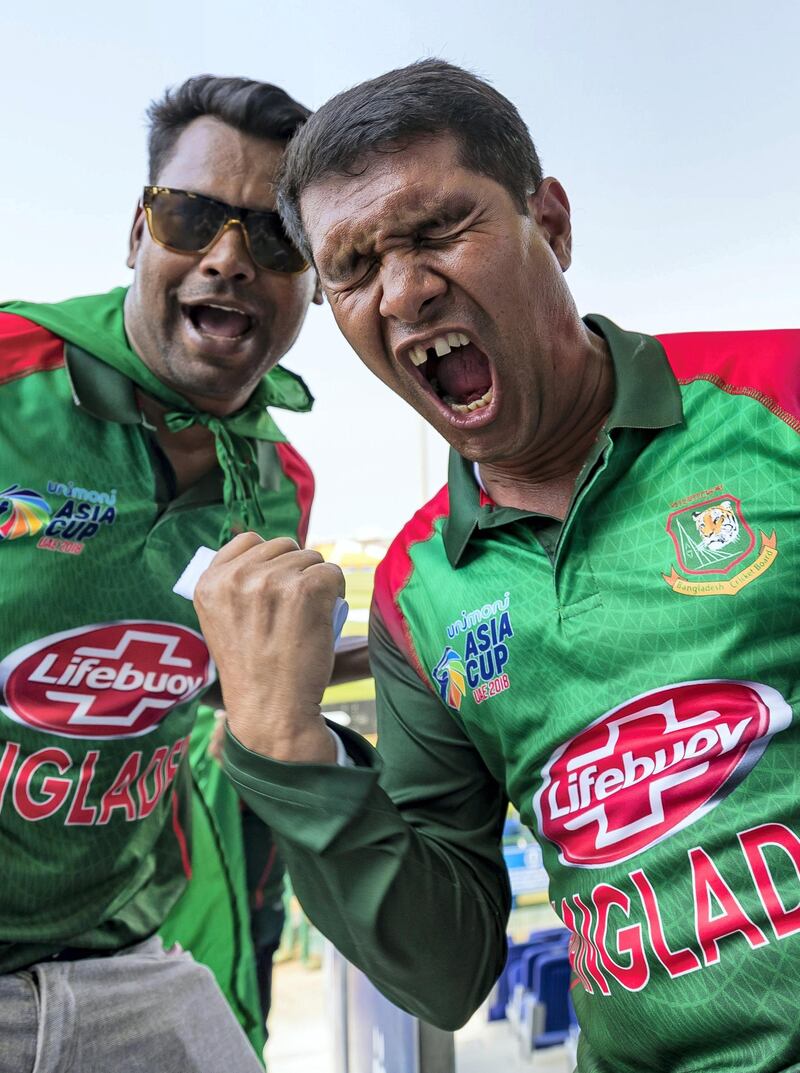 Abu Dhabi, United Arab Emirates - September 20, 2018: Bangladesh fans before the game between Bangladesh and Afghanistan in the Asia cup. Th, September 20th, 2018 at Zayed Cricket Stadium, Abu Dhabi. Chris Whiteoak / The National