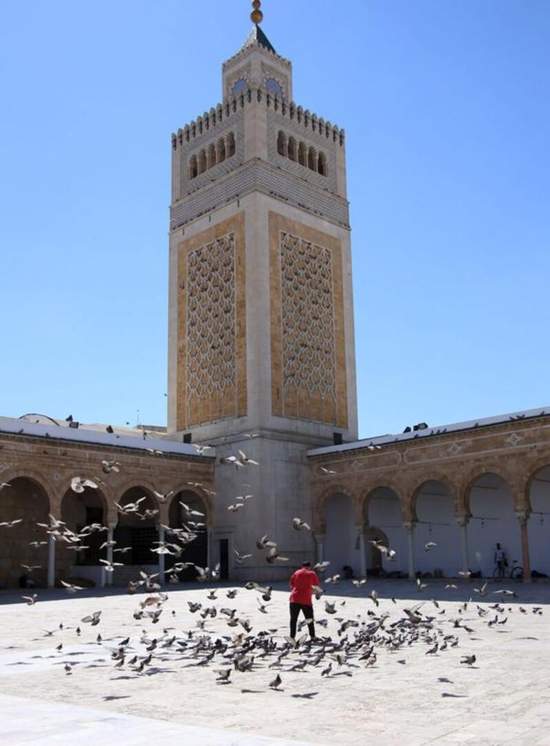 A man feeds pigeons in the Zitouna mosque during the month of Ramadan in Tunis, Tunisia, on June 20, 2015. Zoubeir Souissi / Reuters