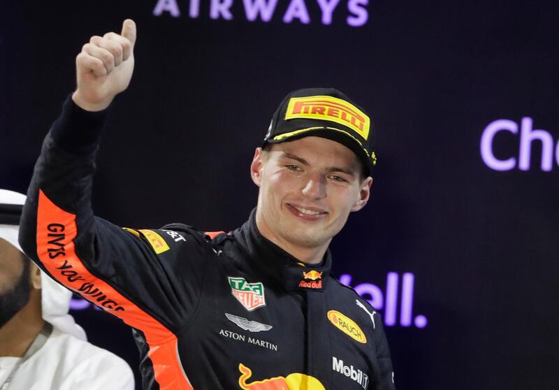 Red Bull driver Max Verstappen of the Netherlands celebrates his third place on the podium after the Emirates Formula One Grand Prix at the Yas Marina racetrack in Abu Dhabi, United Arab Emirates, Sunday, Nov. 25, 2018.(AP Photo/Luca Bruno)