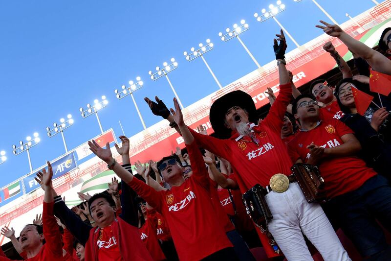 China supporters cheer ahead of the 2019 AFC Asian Cup group C football match between Philippines and China at the Mohammed Bin Zayed Stadium in Abu Dhabi. AFP