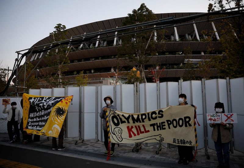 Protesters demanding cancellation of Tokyo 2020 Olympic Games hold a rally in front of the National Stadium in Tokyo. Reuters