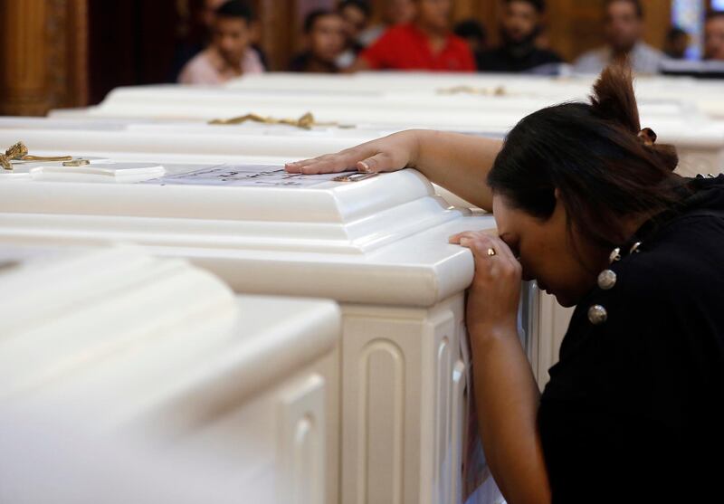 A relative of a slain Christian grieves during the funeral service at Church of Great Martyr Prince Tadros. AP Photo