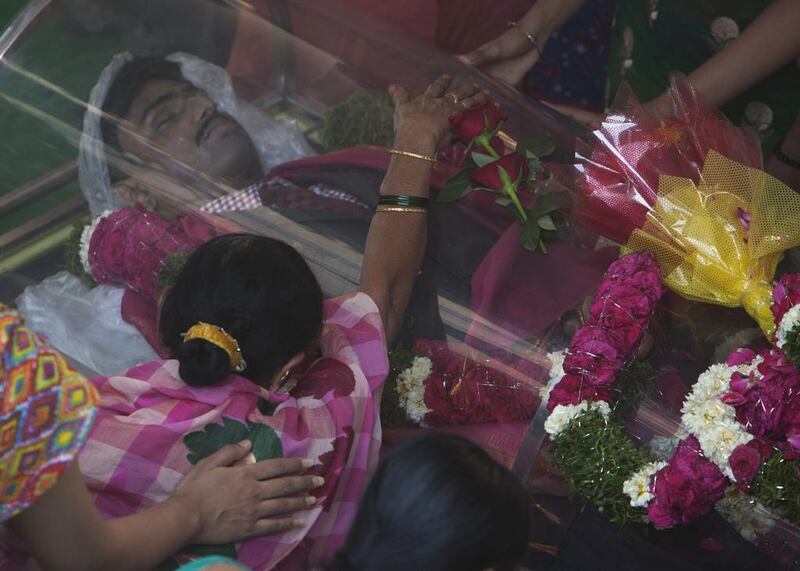 Parvatha Vardhini grieves by the body of her son Srinivas Kuchibhotla, a 32-year-old engineer who was killed in an apparently racially motivated shooting in a crowded Kansas bar. Mahesh Kumar A. / AP Photo