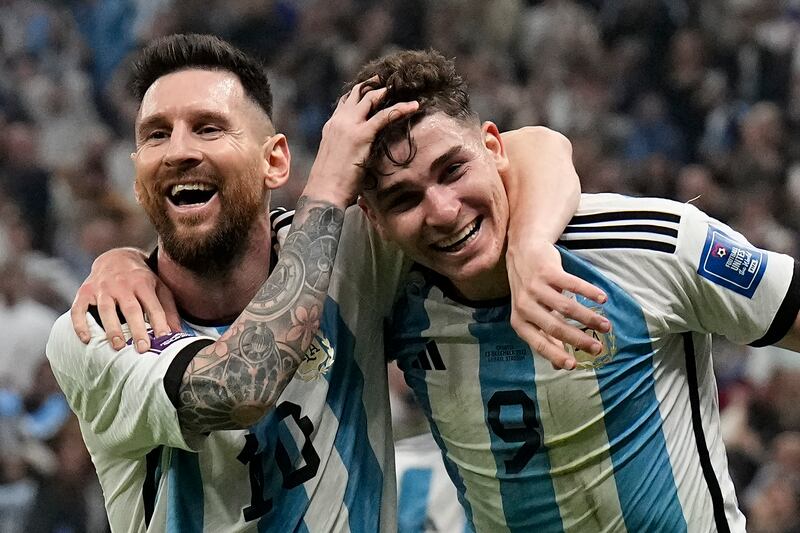Argentina's Lionel Messi and Julian Alvarez celebrate during the 3-0 World Cup semi-final win against Croatia at the Lusail Stadium on December  13, 2022. AP