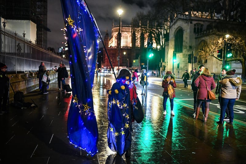Anti-Brexit campaigners protest outside the Houses of Parliament in London. Getty Images
