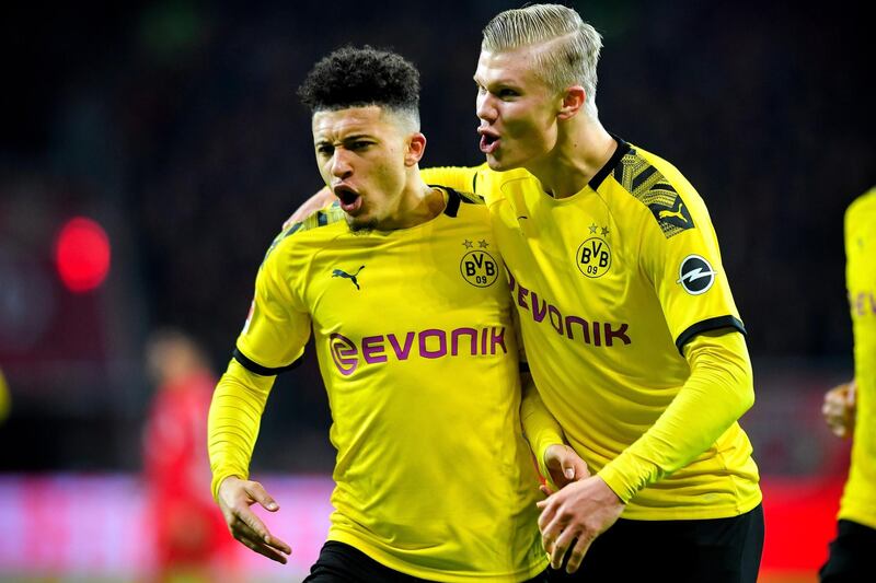epa08203609 Dortmund's Jadon Sancho (L) reacts with his teammate Erling Haaland (R) after scoring the 3-2 lead during the German Bundesliga soccer match between Bayer Leverkusen and Borussia Dortmund at BayArena in Leverkusen, Germany, 08 February 2020.  EPA/SASCHA STEINBACH CONDITIONS - ATTENTION: The DFL regulations prohibit any use of photographs as image sequences and/or quasi-video.