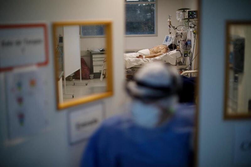 A heath worker does a round at an intensive care unit designated for people infected with Covid-19 at a hospital in Buenos Aires, Argentina. AP Photo