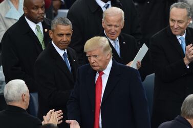 US President Donald Trump(C)is appluaded by former President Barack Obama(L), former Vice President Joe Biden and Sen. Chuck Schumer(R), D-NY, during Trump's inauguration ceremonies at the US Capitol in Washington, DC, on January 20, 2017.  AFP 