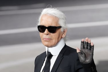 Karl Lagerfeld was rarely seen without gloves on (AP Photo/Christophe Ena, File)