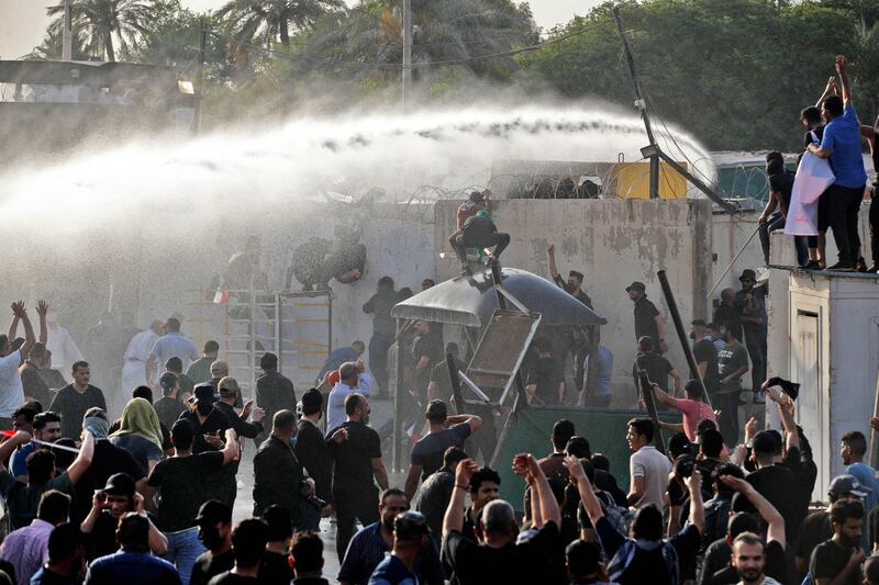 Security forces use water cannon to prevent supporters of the Co-ordination Framework from entering the Green Zone. AFP