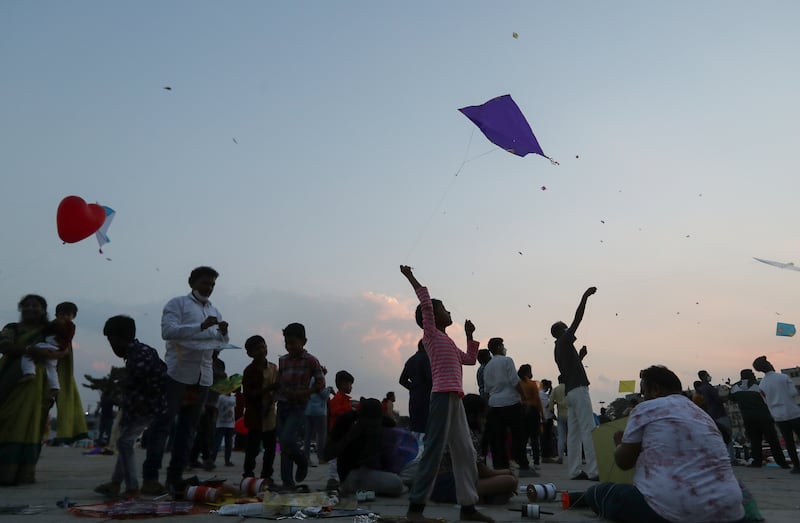 People fly kites during Makar Sankranti festival in Hyderabad, India. AP