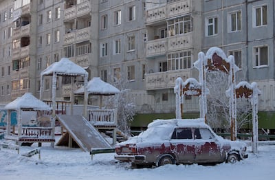 A car covered in ice is pictured near a playground in Yakutsk, in the Republic of Sakha in February 2013. Reuters