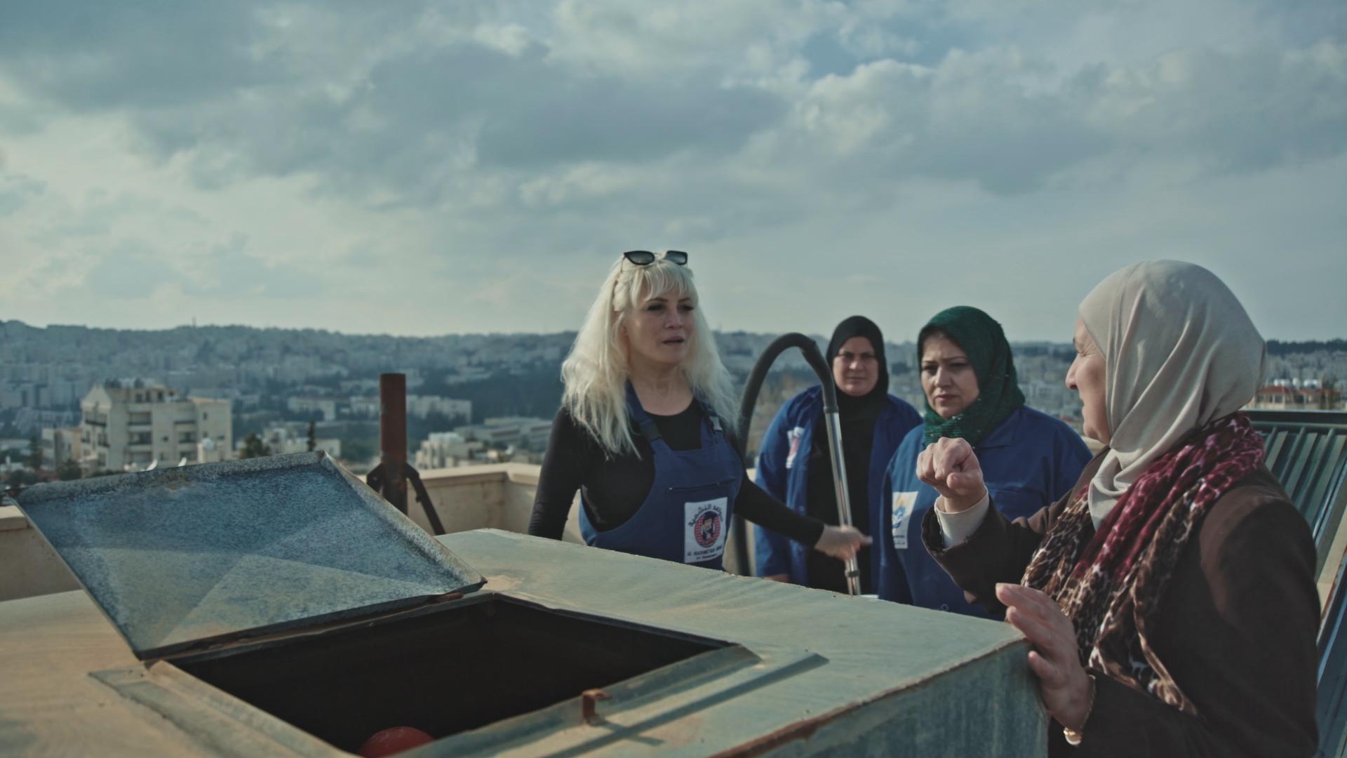 Khawla Al Sheikh, left, leads the way in this scene from ‘Waterproof’. The documentary, shot in Amman, follows the fortunes of Al Sheikh and fellow members of her NGO for female plumbers