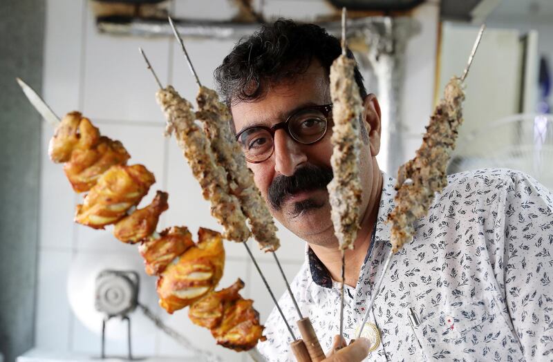 DUBAI , UNITED ARAB EMIRATES , January 9 ��� 2019 :- Majeed Al Ustad , owner holding different types of kabab���s at the Ustad Special Kabab Iranian restaurant in Bur Dubai in Dubai. ( Pawan Singh / The National ) For News. Story by Nick Webster 