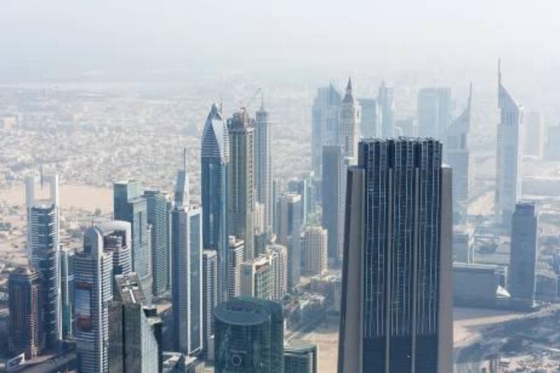 Skyscrapers stand in the Sheikh Zayed road area of Dubai, United Arab Emirates, on Thursday, May 30, 2013.Photographer: Duncan Chard/Bloomberg *** Local Caption ***  1230539.jpg