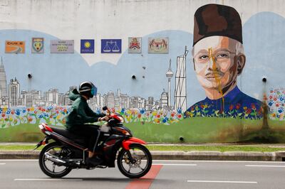 A mural vandalised with yellow paint depicting former Malaysia prime minister Najib Razak at Kuala Lumpur, Malaysia, December 8. EPA 