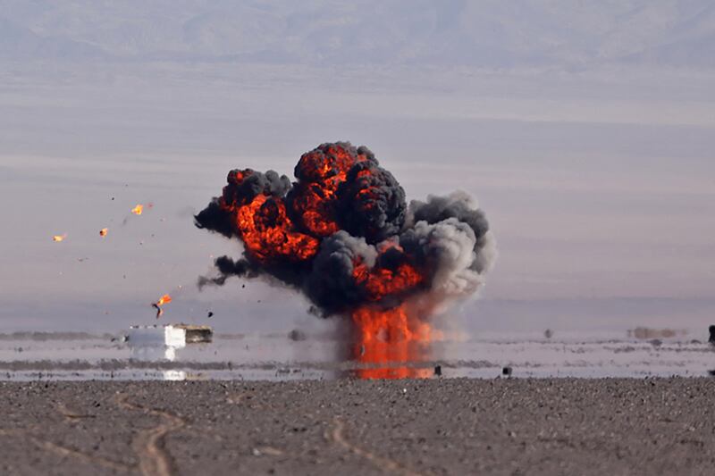 An explosion after a strike by a military drone during drills at an undisclosed location in Iran. AFP