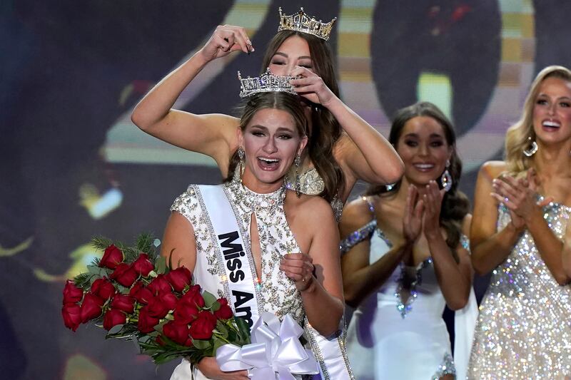 Miss Wisconsin 2022 Grace Stanke, center, is crowned as Miss America 2023 by Miss America 2022 Emma Broyles, behind center, at the conclusion of the Miss America competition at the Mohegan Sun casino, in Uncasville, Conn. , Thursday, Dec.  15, 2022.  (AP Photo / Steven Senne)