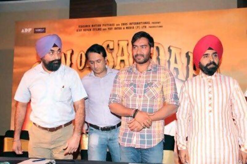 The Son of Sardaar actor Ajay Devgan, third from left, and the congress leader Charan Singh Sapra, right, were among people who recently met in Mumbai to address the Sikh community's concerns about the film. IANS