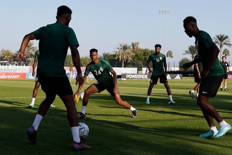 Saudi Arabia's Nasser Al Dawsari, Sami Al Najei and teammates attend a training session at the Sealine Training Site. AFP