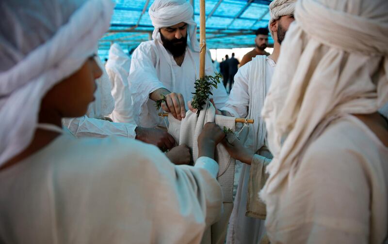 Mandaeans, a small ethnic and religious minority, perform rituals during the Benja festival in Baghdad, Iraq. Reuters
