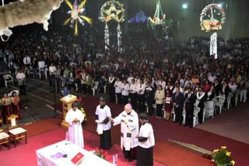 ABU DHABI - 24DEC2010 -  Christmas mass at Saint Joseph's Chruch yesterday in Abu Dhabi. Ravindranath K / The National