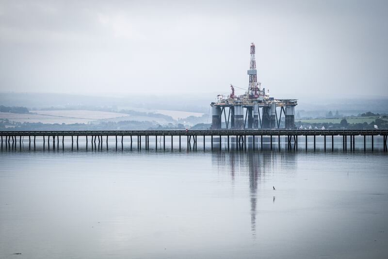 An oil rig anchored in the Cromarty Firth, in Invergordon. The oil and gas industry adds about £16 billion to the UK economy. PA