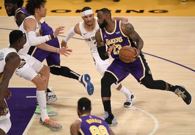 LOS ANGELES, CALIFORNIA - JANUARY 15: LeBron James #23 of the Los Angeles Lakers drives to the basket in front of Josh Hart #3 of the New Orleans Pelicans during the first half at Staples Center on January 15, 2021 in Los Angeles, California.   Harry How/Getty Images/AFP
== FOR NEWSPAPERS, INTERNET, TELCOS & TELEVISION USE ONLY ==
