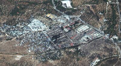 epa08659908 A handout satellite image made available by MAXAR Technologies shows the remains of burnt-down Moria refugee camp one day after it was devastated by raging fires near Mytilene, Lesbos island, Greece, 10 September 2020. A fire broke out in the overcrowded Moria Refugee Camp early 09 September 2020, destroying large parts of some 13,000 refugees' accommodations. The military camp which serves as a European Union's so-called 'hotspot' was designed to hold some 3,000 people, but has at times been the dwelling of some 20,000 refugees.  EPA/MAXAR TECHNOLOGIES / HANDOUT -- MANDATORY CREDIT: SATELLITE IMAGE 2020 MAXAR TECHNOLOGIES -- the watermark may not be removed/cropped -- HANDOUT EDITORIAL USE ONLY/NO SALES