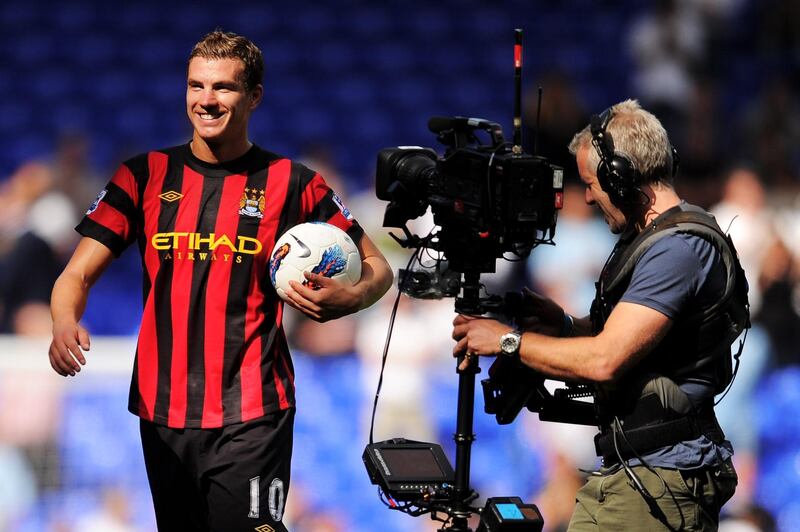 LONDON, ENGLAND - AUGUST 28:  Edin Dzeko of Manchester City leaves the pitch with the matchball after scoring four goals after the Barclays Premier League match between Tottenham Hotspur and Manchester City at White Hart Lane on August 28, 2011 in London, England.  (Photo by Michael Regan/Getty Images)