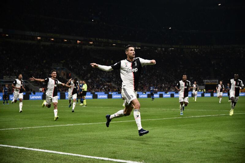 Juventus' Portuguese forward Cristiano Ronaldo celebrates after scoring a goal that was later rescinded during the Italian Serie A football match Inter vs Juventus on October 6, 2019 at the San Siro stadium in Milan.  / AFP / Marco BERTORELLO                    

