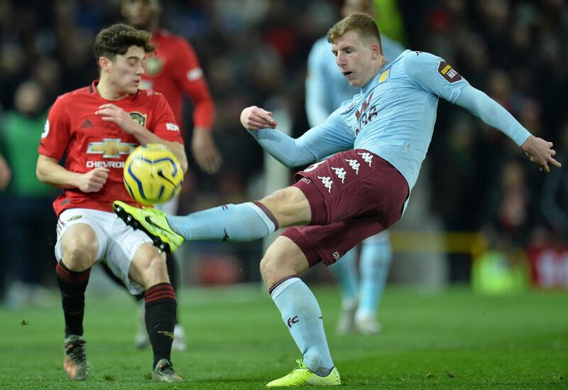 An Aston Villa player clears the ball. EPA