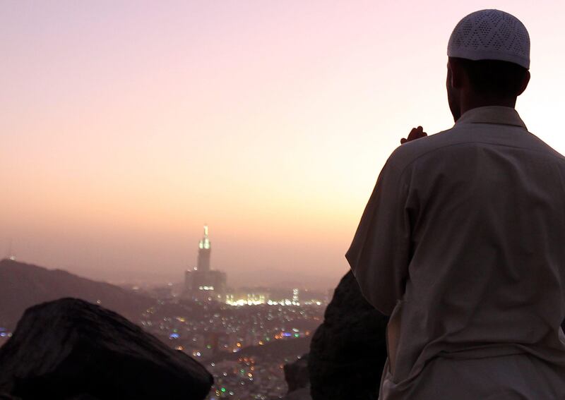 epa02991620 A Muslim pilgrim prays during sunset  near top of Jabal-al-noor (the Mountain of Light in Arabic), one day before the Hajj 2011 pilgrimage, near Mecca, Saudi Arabia, 03 November 2011. The Mountain of Light (Jabal-al-noor) near Mecca is a mountain that lies in the Hejaz region of Saudi Arabia. According to tradition, Muslim's Prophet Mohamed received the first revelations from Allah about islam, while meditating in the Heraa cave located on the Jabal-al-Noor. The Hajj 2011 is due to take place from 04 to 09 November.  EPA/AMEL PAIN *** Local Caption ***  02991620.jpg