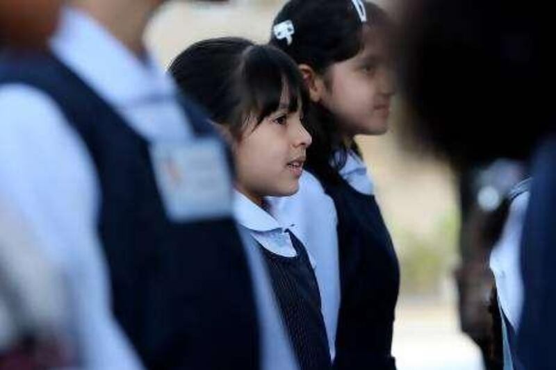 DUBAI, UNITED ARAB EMIRATES Ð Sep 19: Maitha Al Ayali (center) during the assembly on the first day at Jumeirah Model Girls School in Dubai. (Pawan Singh / The National) For News. Story by Bana