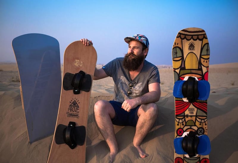 Simon Hunt makes and shapes sandboards for friends, but he has won a contract to start selling them in the UAE. Middle East artists will help design the graphics, giving them a local look. Victor Besa for The National