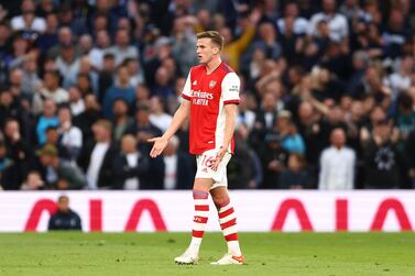 LONDON, ENGLAND - MAY 12: Rob Holding of Arsenal looks dejected after being shown a red card for a foul on Heung-Min Son of Tottenham Hotspur (not pictured) during the Premier League match between Tottenham Hotspur and Arsenal at Tottenham Hotspur Stadium on May 12, 2022 in London, England. (Photo by Clive Rose / Getty Images)