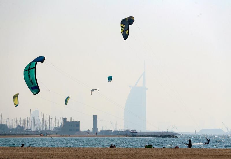 Dubai, United Arab Emirates - Reporter: N/A. News. Standalone. People kite surfer with the Burj Al Arab in the background in Dubai. Thursday, October 8th, 2020. Dubai. Chris Whiteoak / The National