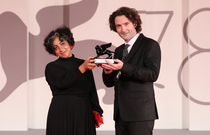 Directors May Abdalla and Barry Gene Murphy pose with the Grand Jury Prize for Best VR for 'Goliath: Playing With Reality'. Getty Images