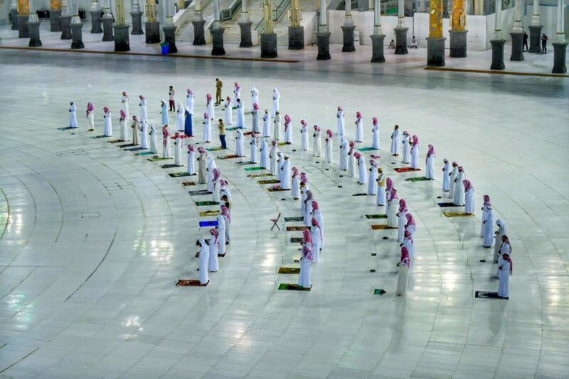 Muslims pray during the Laylat al-Qadr, or Night of Power, the holiest night for Muslims, while practicing social distancing, following the outbreak of the coronavirus disease (COVID-19), during the fasting month of Ramadan, at the Grand Mosque in Mecca, Saudi Arabia. REUTERS