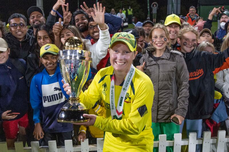 Alyssa Healy poses with the trophy after Australia win the 2022 Women's Cricket World Cup. AP