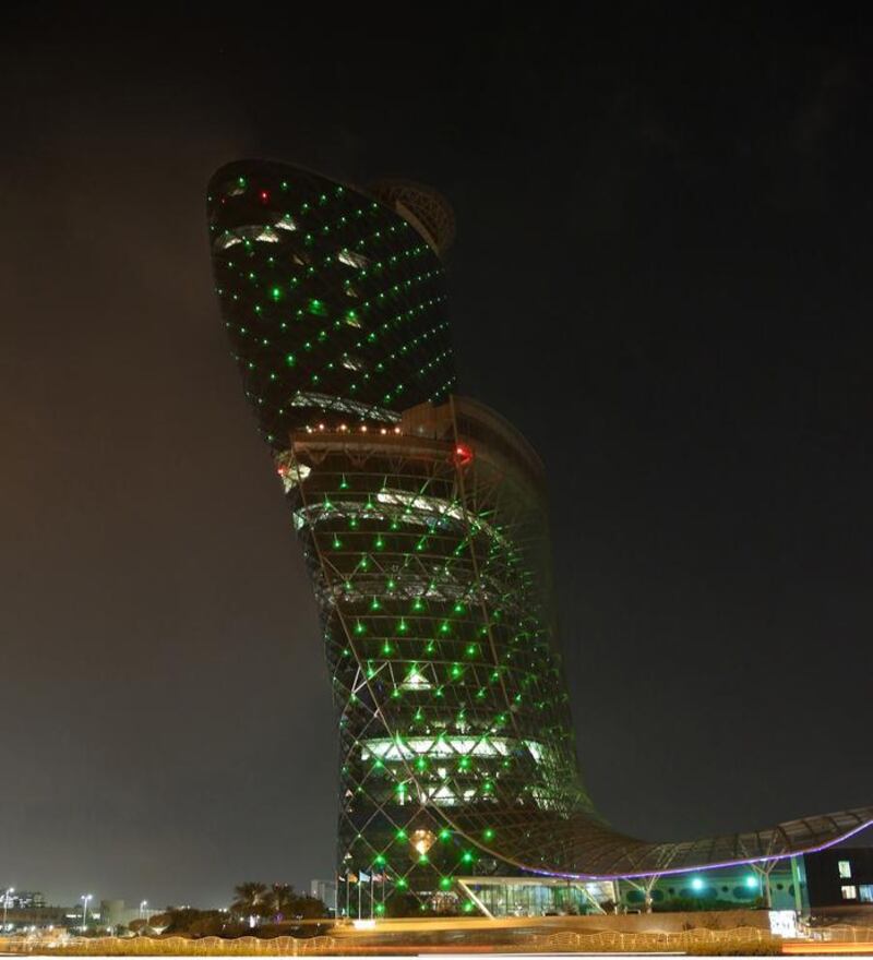 Capital Gate is alight with green to mark Saudi National Day. Wam