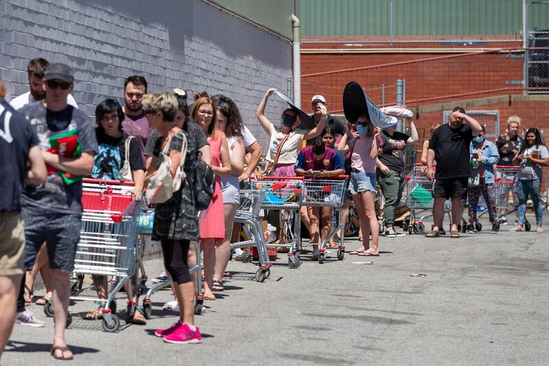 People queue outside a supermarket in Perth, Australia. EPA