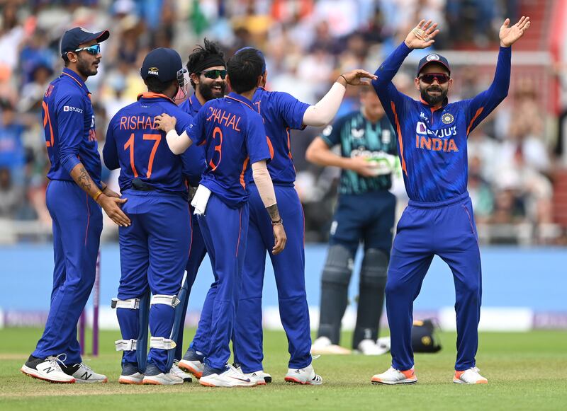 India fielder Virat Kohli weaves at the crowd after the wicket of England batter Moeen Ali. Getty