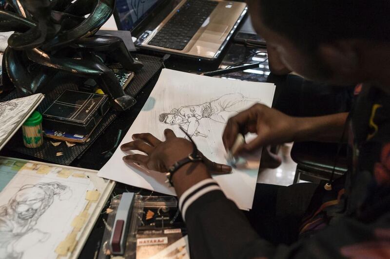 An illustrator works on a sketch at the Comic Republic office in Lagos. Stefan Heunis / AFP