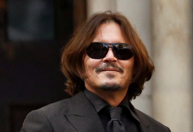 Depp leaves the High Court in London, England, on July 22, 2020, during the libel case there.  Reuters